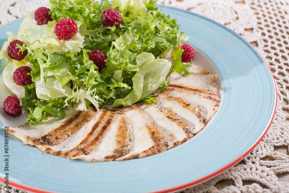 chicken fillet slices and raspberry in lettuce chicken fillet slices and raspberry in lettuce