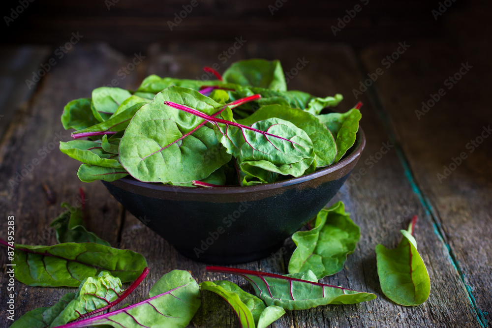 Fresh chard leaves on rustic background Fresh chard leaves on rustic background