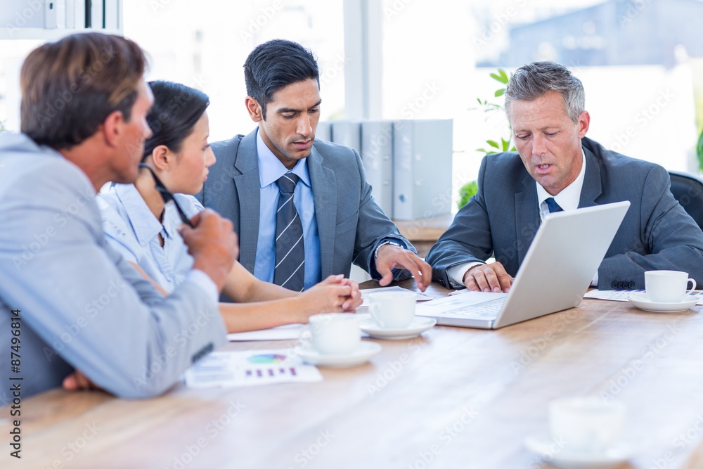 Business people speaking together during meeting Business people speaking together during meeting