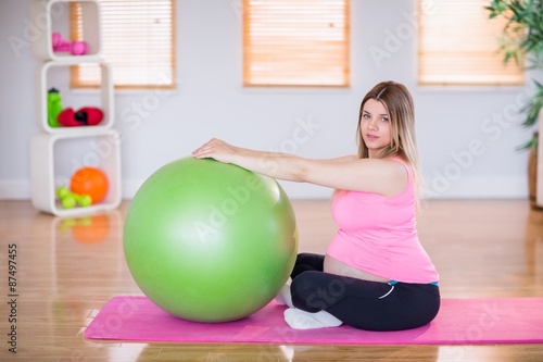 Pregnant woman doing exercise with exercise ball 