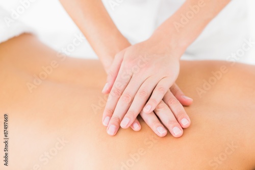 Woman receiving back massage at spa center © WavebreakMediaMicro