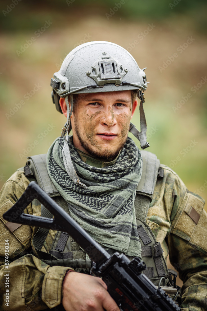 Portrait of a ranger in the battlefield with a gun