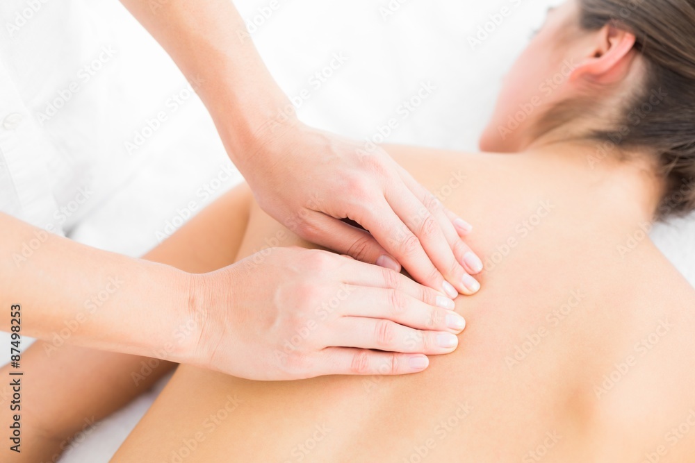 Pretty woman enjoying a back massage Pretty woman enjoying a back massage