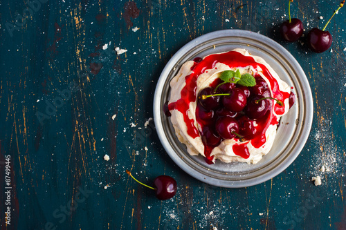 meringues pavlova cake with fresh cherry photo