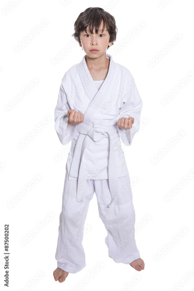 young asian boy isolated on white in judo clothing doing martial arts