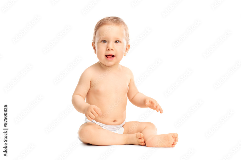 Cute little baby girl sitting on the floor Cute little baby girl sitting on the floor