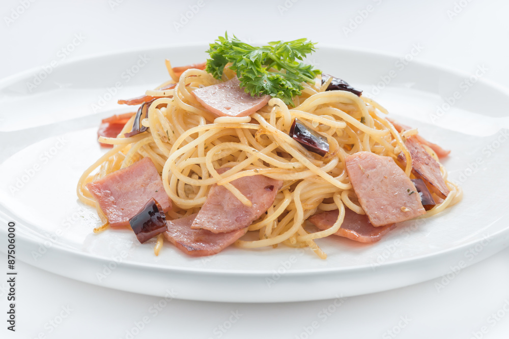 Spaghetti with ham and chilli isolated on white background Spaghetti with ham and chilli isolated on white background