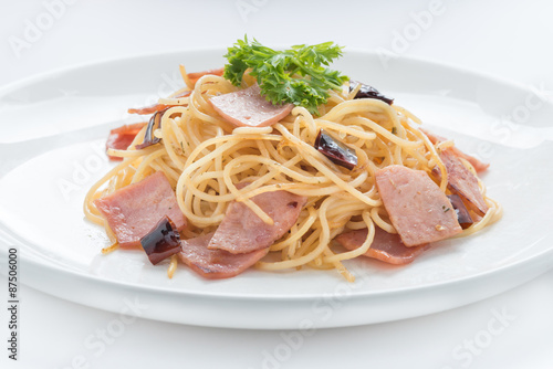 Spaghetti with ham and chilli  isolated on white background