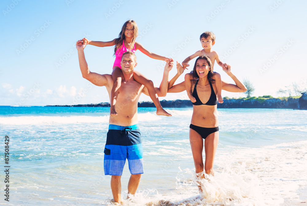 Happy Family Having Fun at the Beach