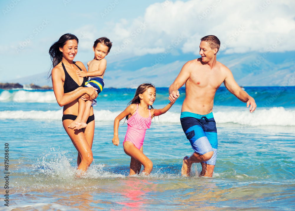 Happy Family Having Fun at the Beach Happy Family Having Fun at the Beach
