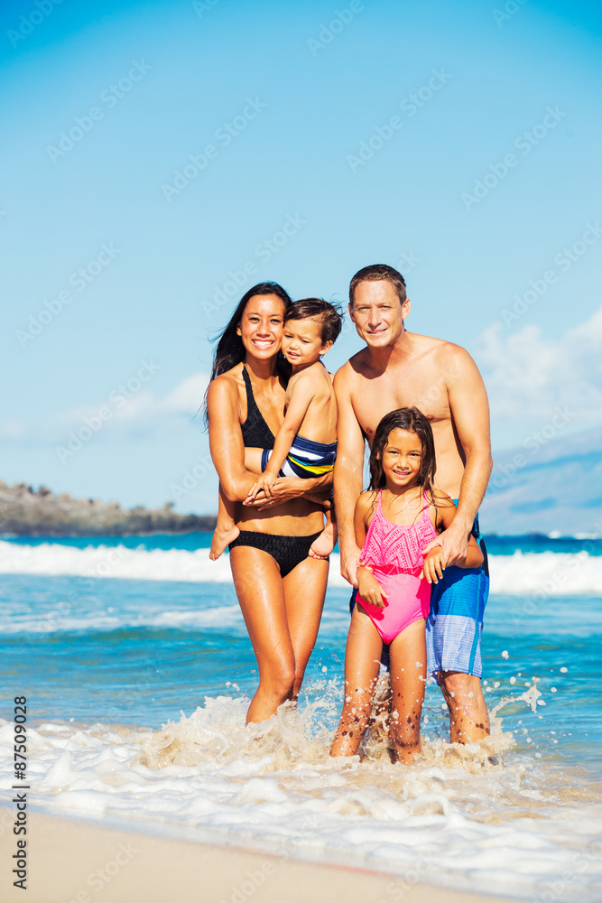 Happy Family Having Fun at the Beach