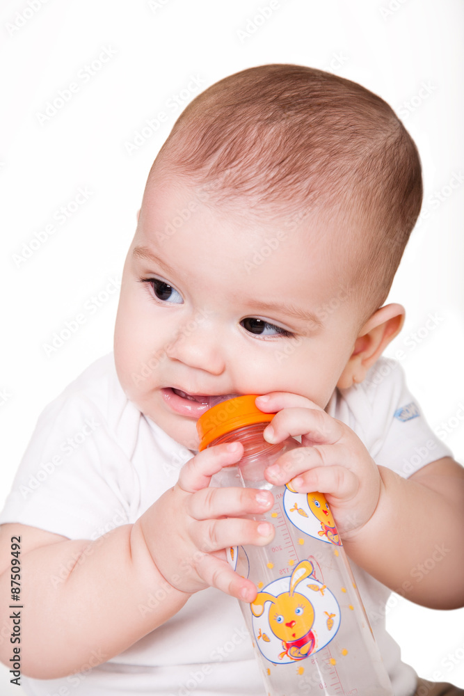 Baby boy drinking water from the bottle Baby boy drinking water from the bottle