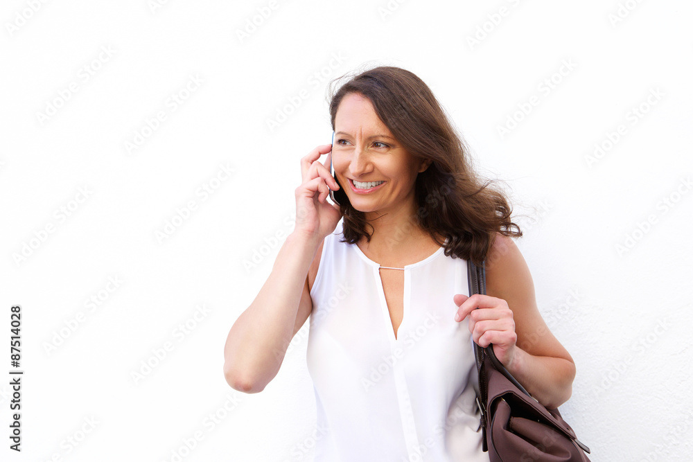 Attractive woman with bag using cell phone Attractive woman with bag using cell phone