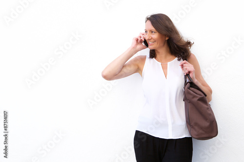 Happy woman having a chat on mobile phone