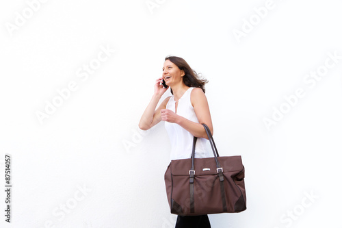 Woman walking and talking on mobile phone