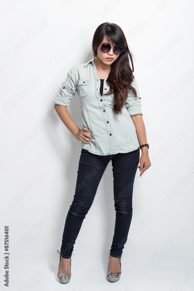 Young asian woman standing and leaning on white background Young asian woman standing and leaning on white background