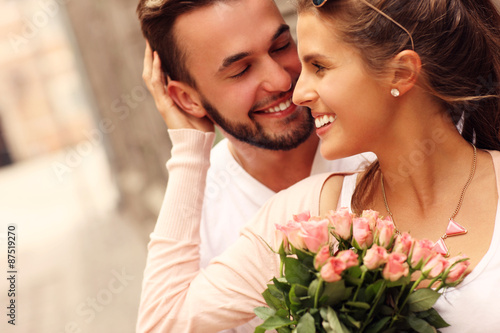 Young romantic couple with flowers