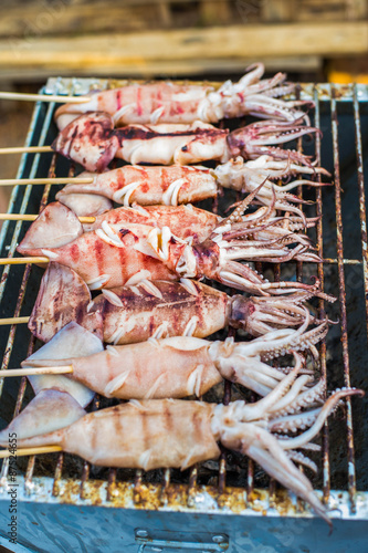 fresh squid barbeque grilled on charcoal stove
