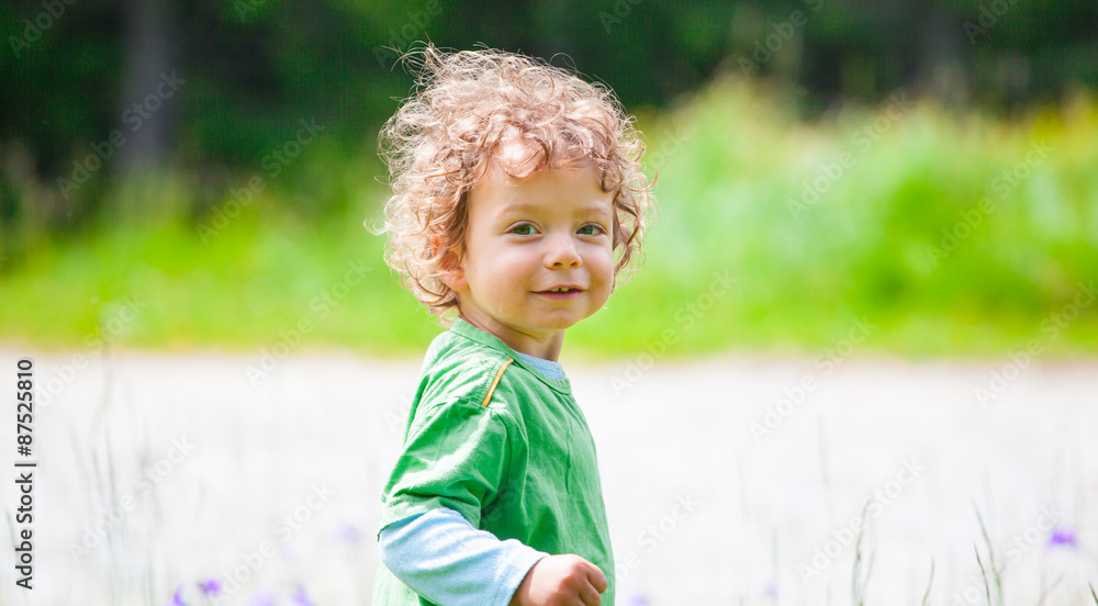 Naklejka premium Portrait of toddler boy outdoor