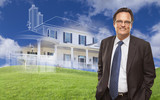 Smiling Businessman with Ghosted House Drawing Behind