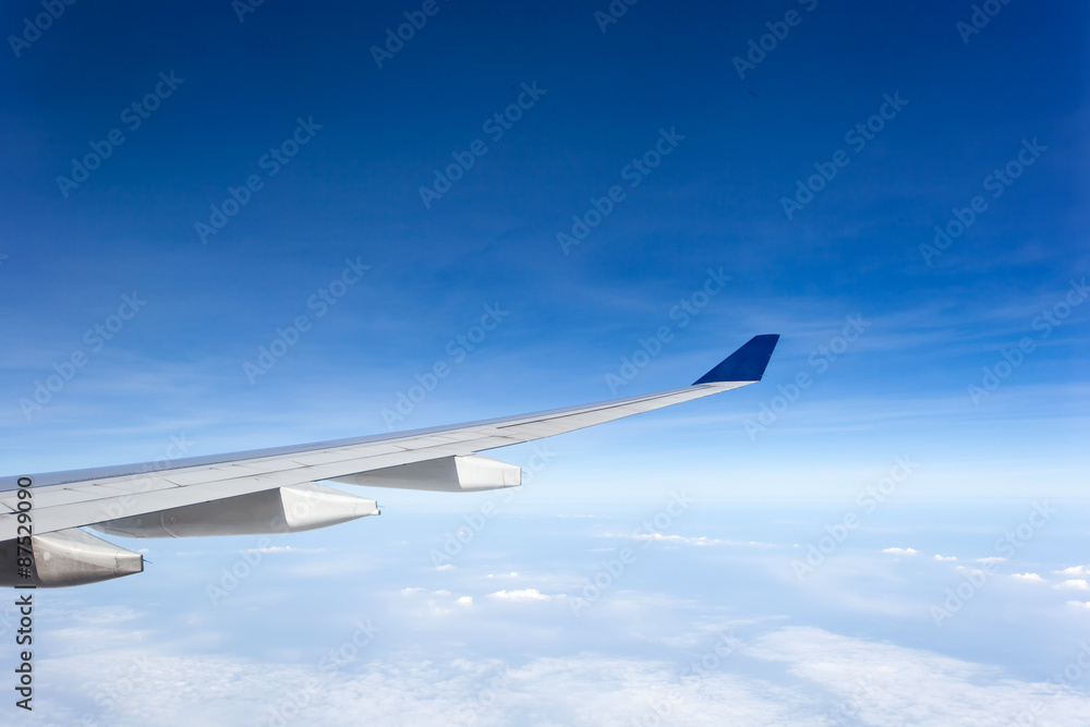 Wing of airplane in blue sky Wing of airplane in blue sky