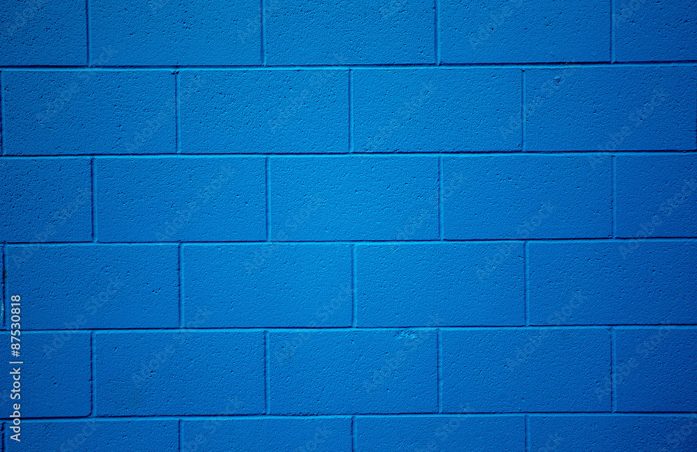 Naklejka premium Blue colored brick background.