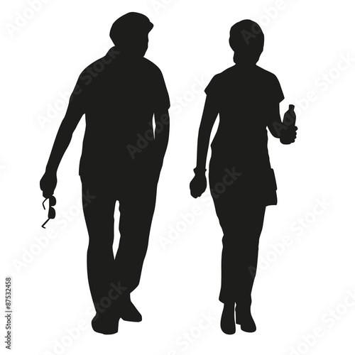 Silhouette of an elderly couple on a walk