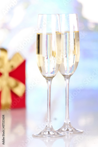 Pair glasses of champagne and present box