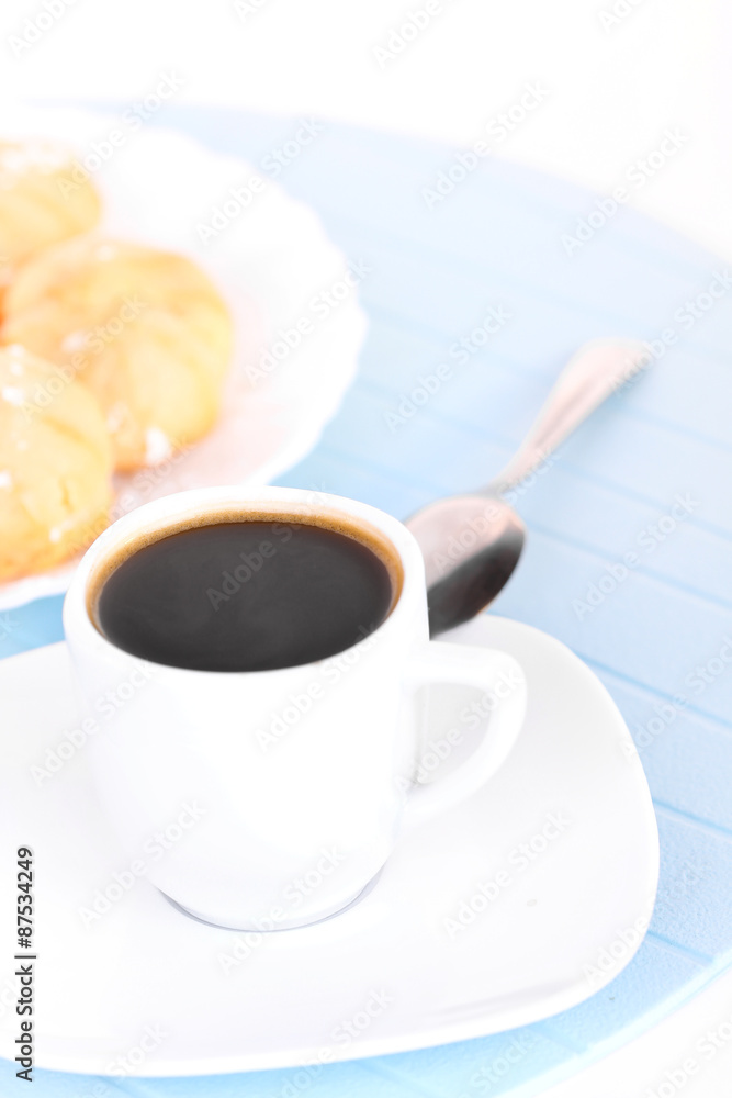 Cup of coffee on blue mat Cup of coffee on blue mat