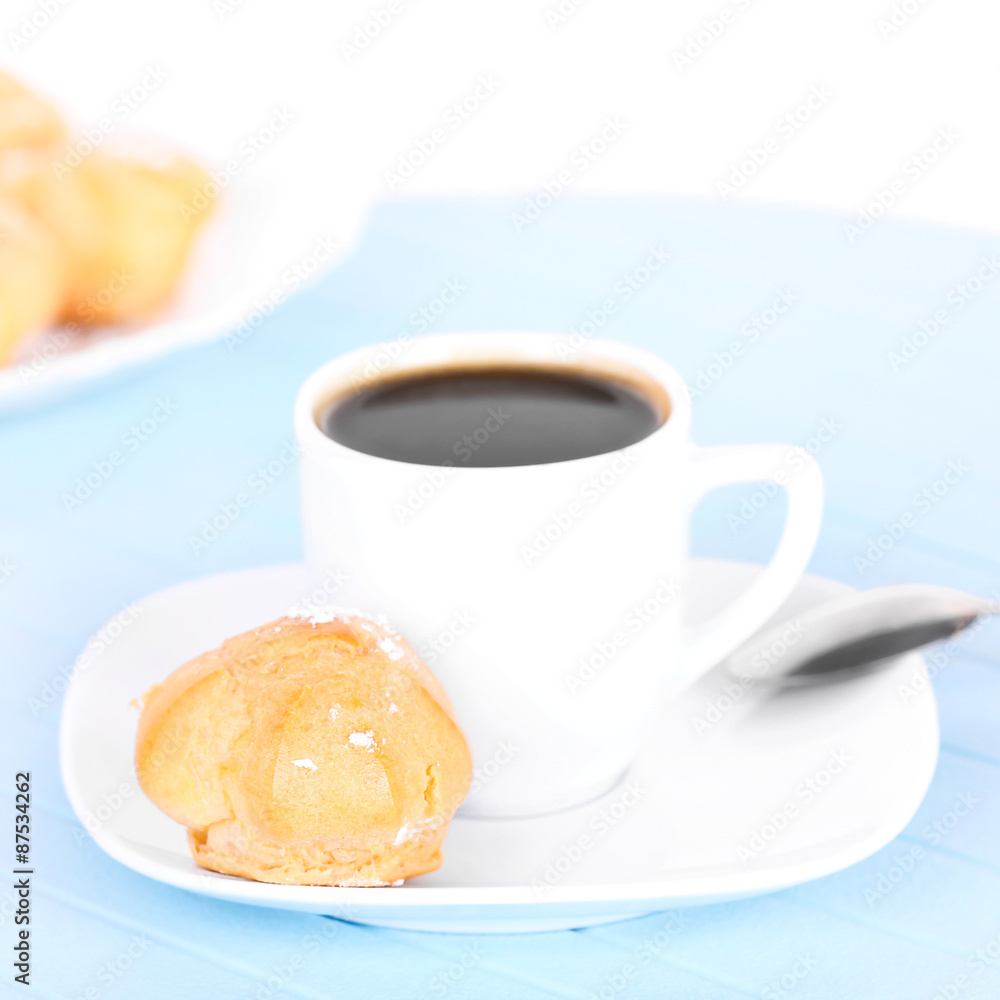 Cup of coffee on blue mat Cup of coffee on blue mat