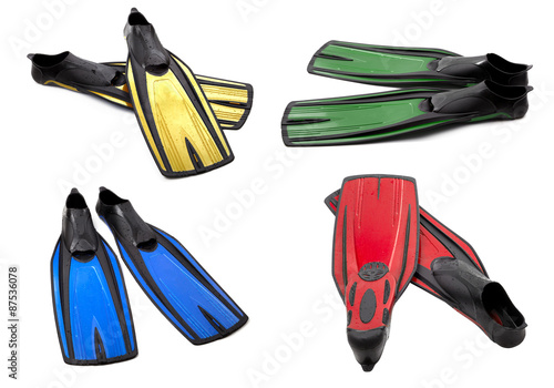 Set of multicolor swim fins for diving on white background