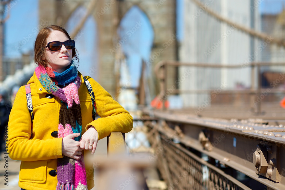 Young woman sightseeing on Brooklyn Bridge Young woman sightseeing on Brooklyn Bridge