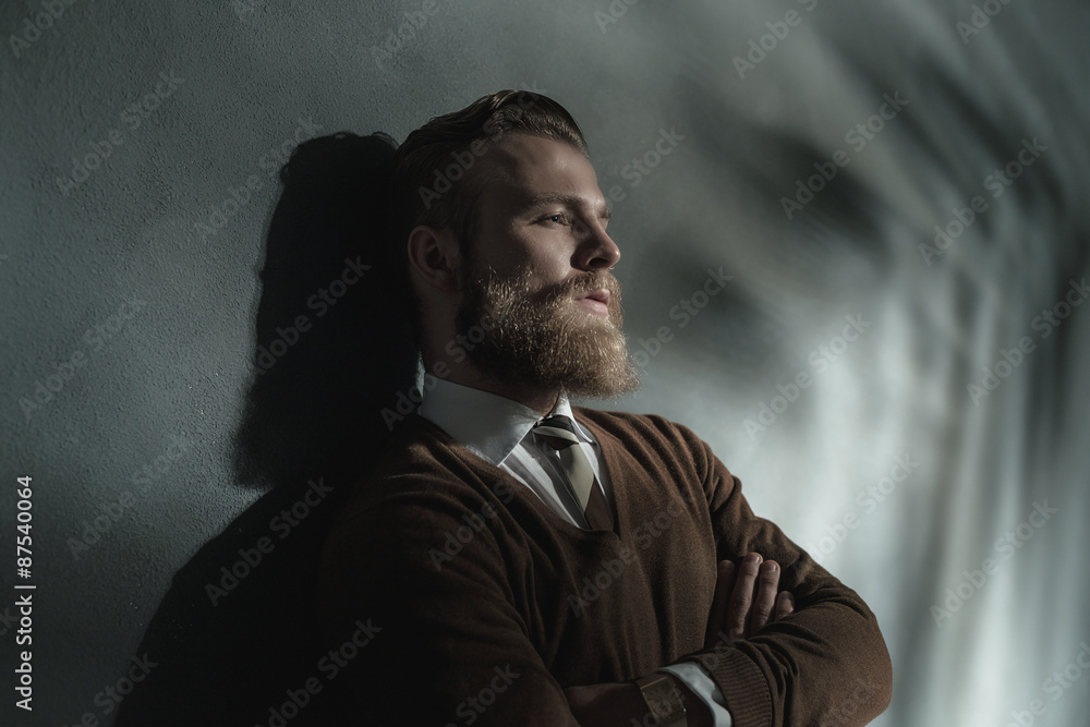 Thoughtful man standing daydreaming Thoughtful man standing daydreaming