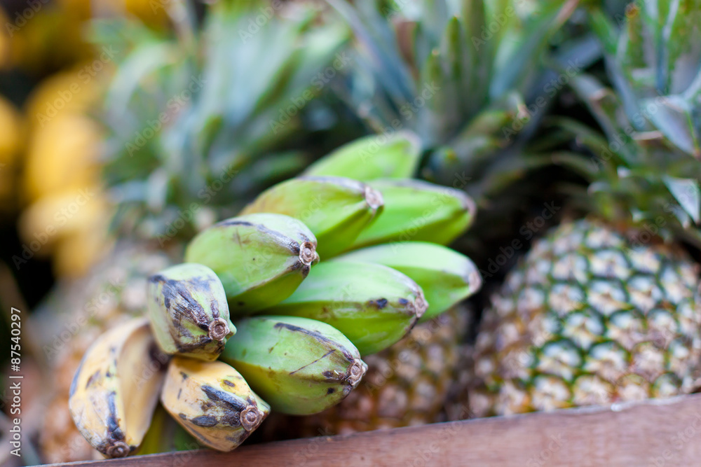 Fototapeta premium Bananas and pineapple on market
