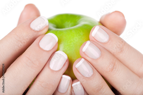 Green apple in hands