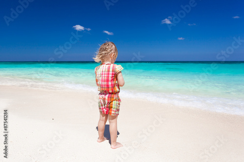 Happy little girl on the beach