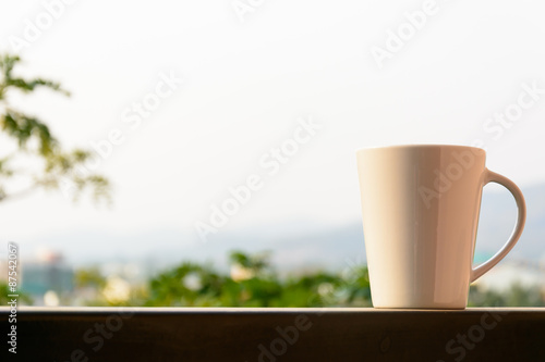 Morning cup of coffee on balcony