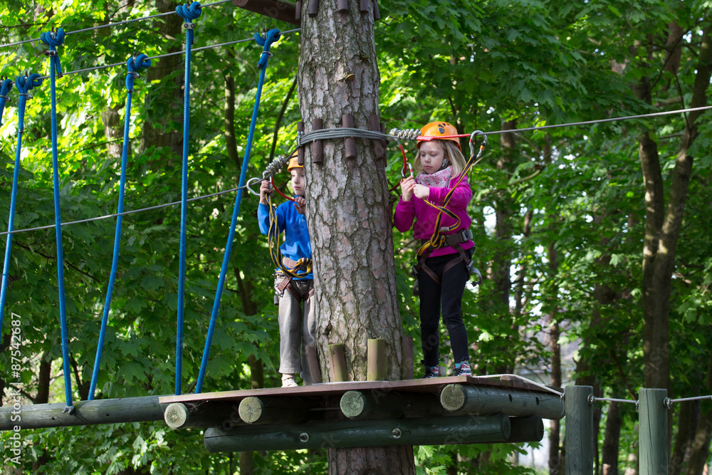 rope park, Girl and boy climbing in adventure park rope park, Girl and boy climbing in adventure park