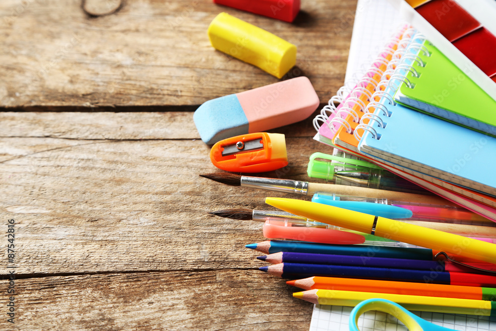 Obraz premium Bright school stationery on old wooden table