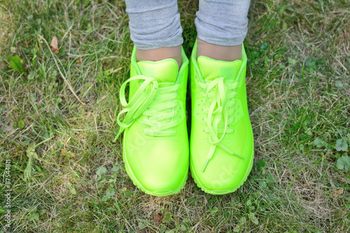 light green sneakers on girl legs