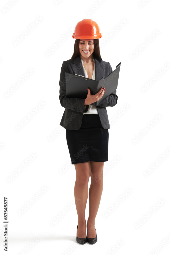 smiley businesswoman reading documents smiley businesswoman reading documents