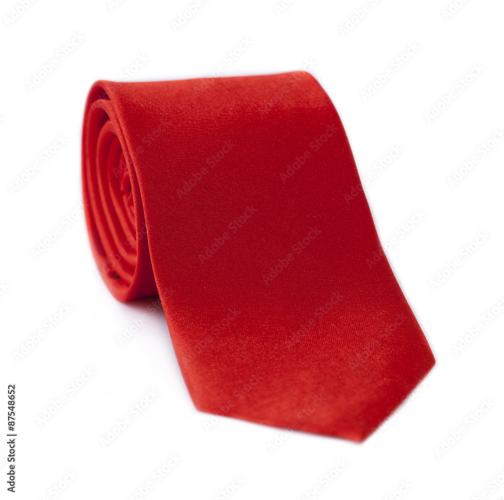 Fototapeta premium Red rolled tie isolated on white background