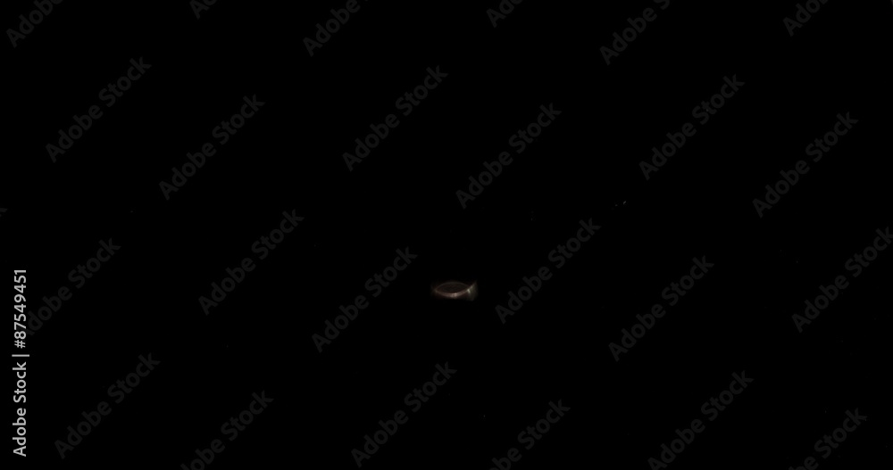 Holding coin and spin on the black background Holding coin and spin on the black background