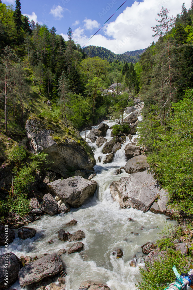 Water rushing by the rocks. Water rushing by the rocks.