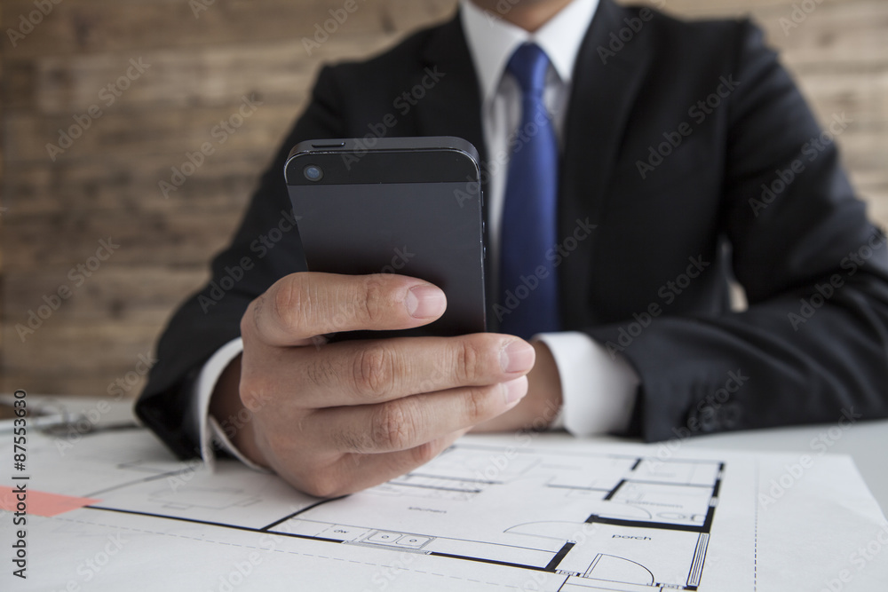 Men are looking for things in the mobile phone Men are looking for things in the mobile phone