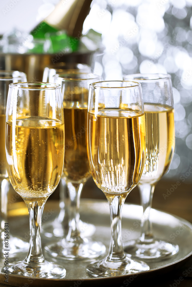 Glasses of champagne on bright background Glasses of champagne on bright background