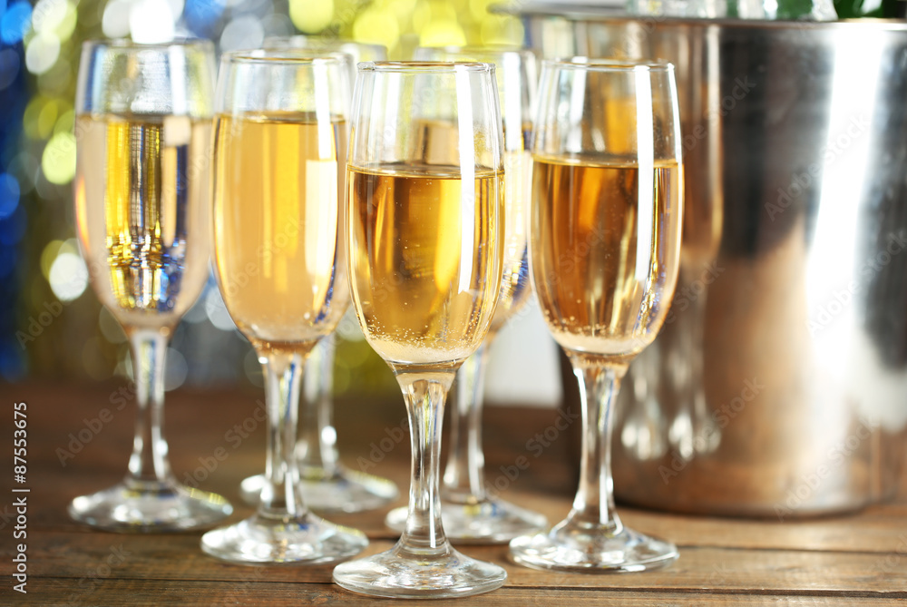 Glasses of champagne on bright background Glasses of champagne on bright background