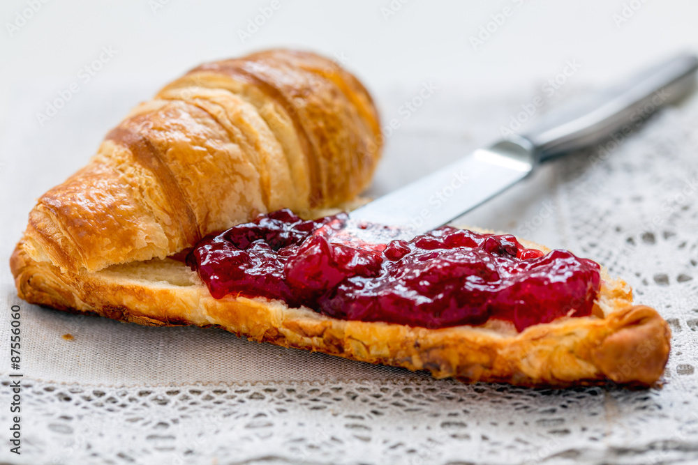 Croissant with lingonberry jam.