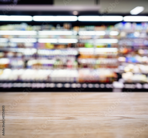 Table top counter Bar with Blurred Supermarket with product shelf © VTT Studio