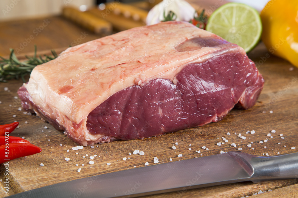 Organic Red Raw Steak Sirloin on wooden board Organic Red Raw Steak Sirloin on wooden board